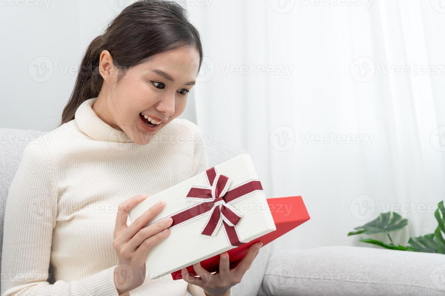 Pretty asian woman feel surprise and look interest inside presents box. cute girl excited open gift box. birthday, Celebration, xmas, New year Festival, thank, Celebrate, Valentine's Day, Anniversary photo