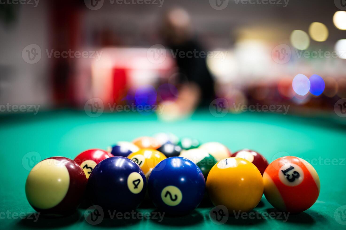 Man preparing to break spheres in billiard photo