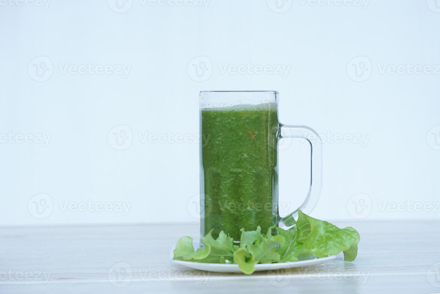 Green smoothie organic herbal vegetables in glass. Concept, healthy beverage for health. Well being and weight loss menu. Homemade refreshing drinks. High fibers, detox. photo