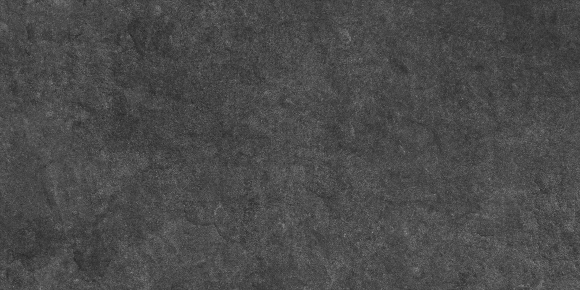 Close up of dark graphite or concrete surface texture, dark black grunge textured blackboard or chalkboard, monochrome slate grunge concrete wall or plaster, distressed overlay concrete texture. photo