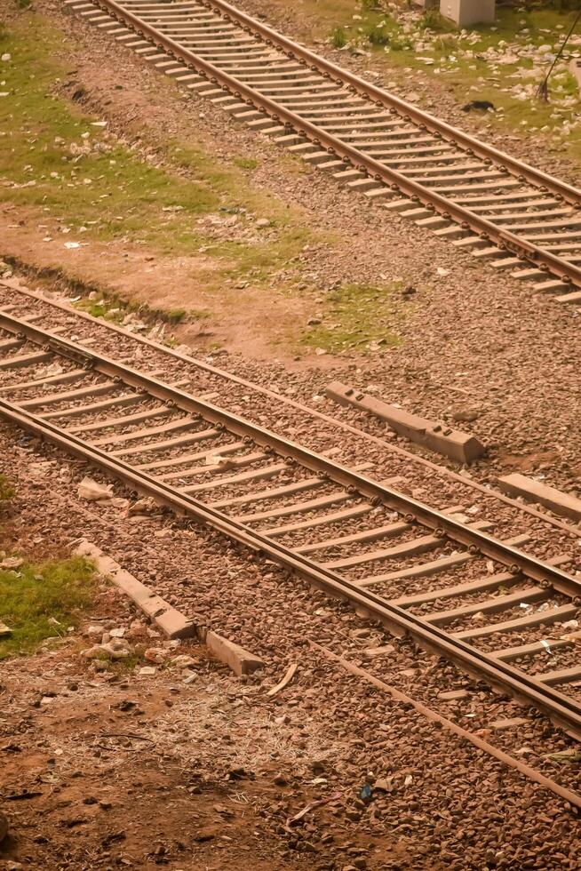 View of train Railway Tracks from the middle during daytime at Kathgodam railway station in India, Train railway track view, Indian Railway junction, Heavy industry photo