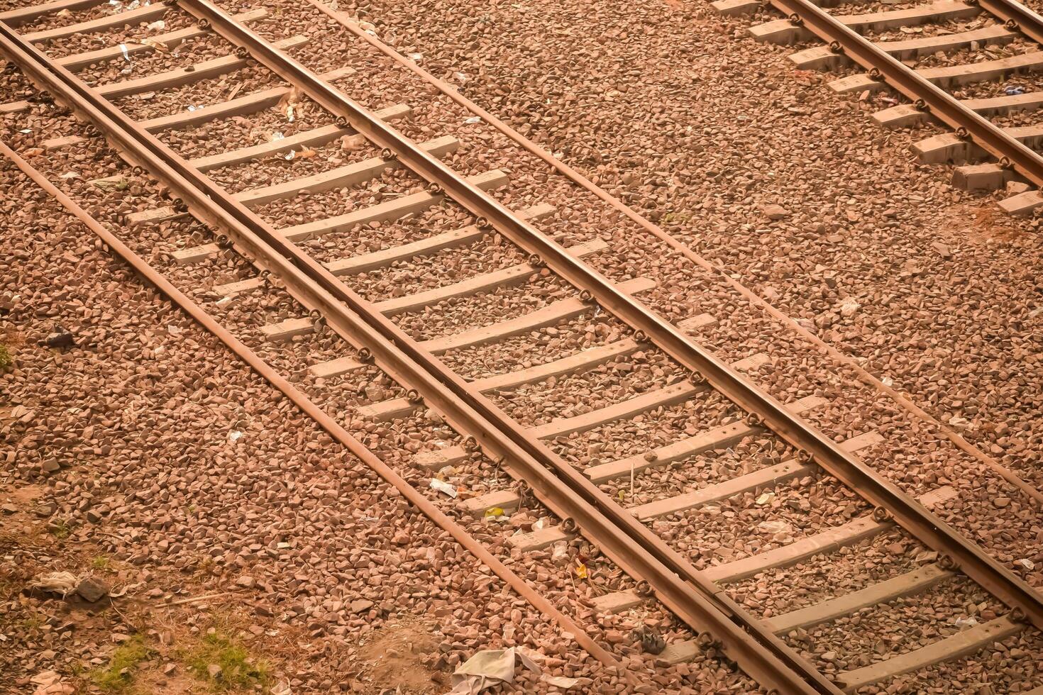 View of train Railway Tracks from the middle during daytime at Kathgodam railway station in India, Train railway track view, Indian Railway junction, Heavy industry photo