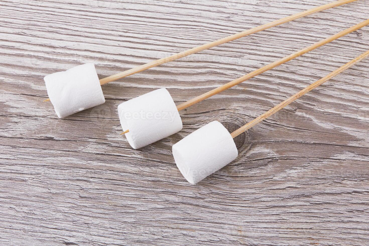 Marshmallows on wood photo