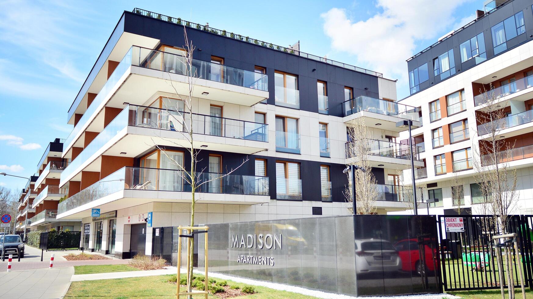 Modern apartment buildings on a sunny day with a blue sky. Facade of a modern apartment building. Glass surface with sunlight. photo