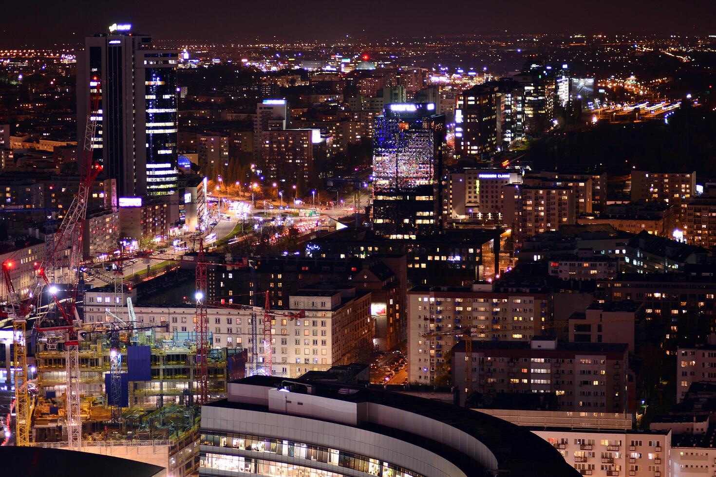 View of at night glass buildings and modern business skyscrapers. View of modern skyscrapers and  business buildings in downtown. Big city at night. photo