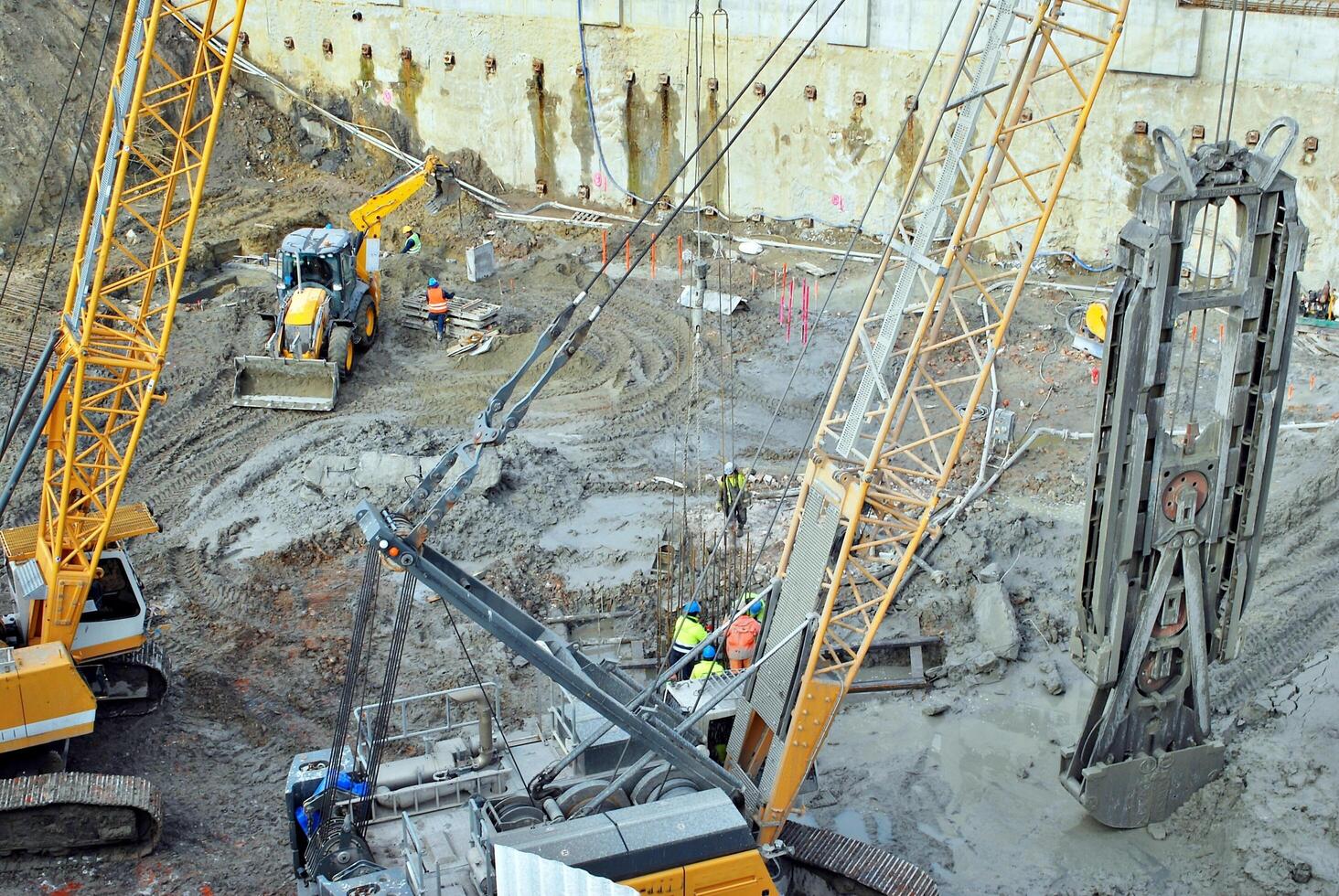 High rise building under construction. Installation of glass facade panels on a reinforced concrete structure. photo