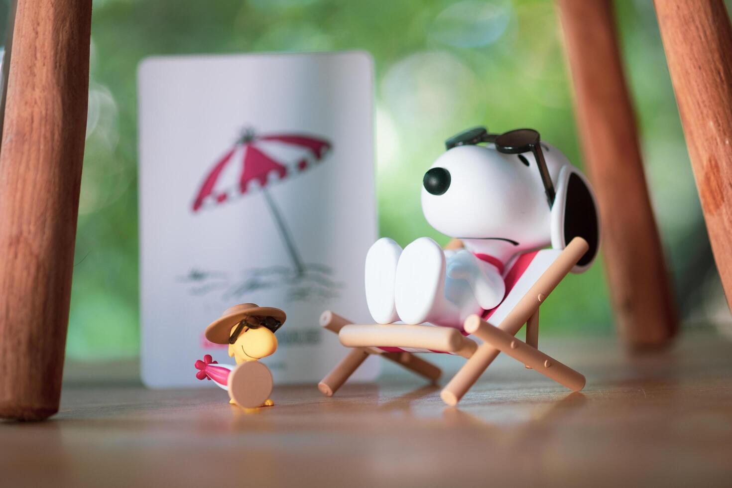 BANGKOK, THAILAND - FEBRUARY 12, 2024 Snoopy Sunbathing. Snoopy the Best Friends series figures. photo