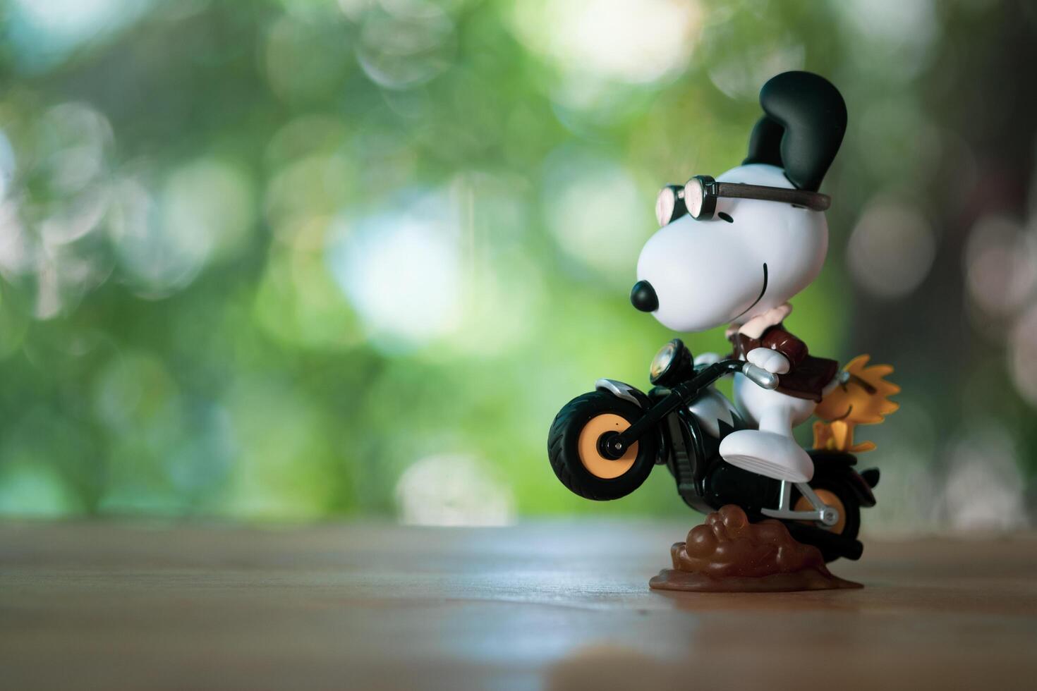 BANGKOK, THAILAND - FEBRUARY 12, 2024 A toy of Snoopy, Motorcycle energy, cute toy from pop mart the Best Friends series figures photo