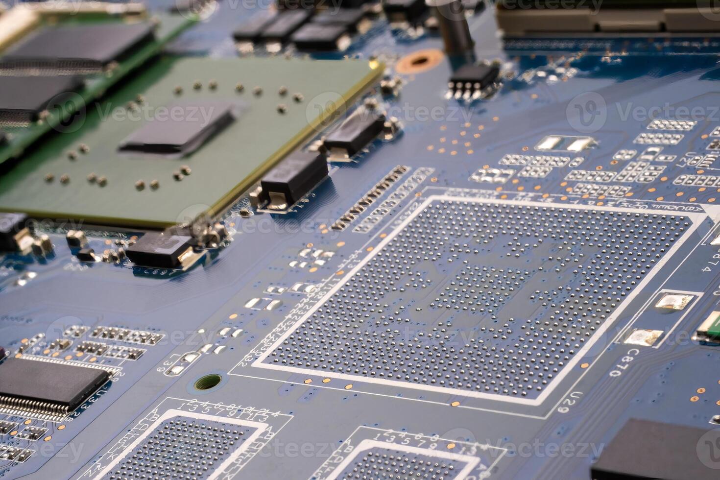 A close up of a computer motherboard with a cpu port on it photo