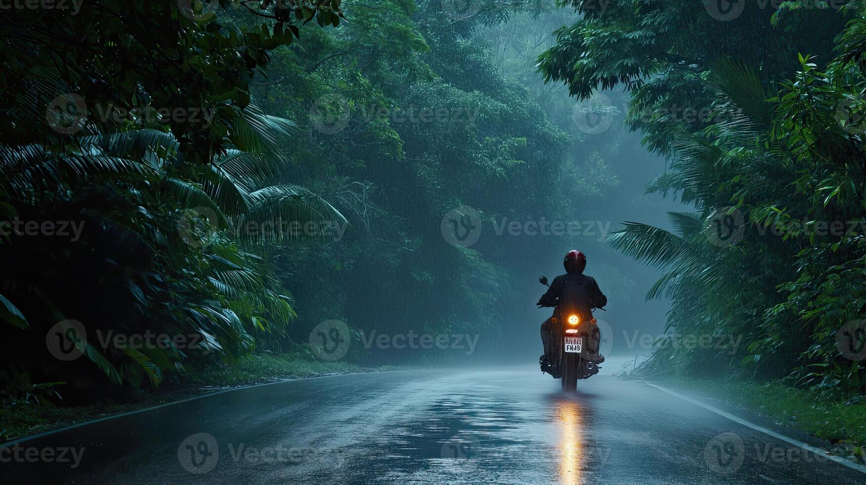 AI generated a motorbike driver navigating through the rain on a densely tree-lined road, the shimmering raindrops and lush foliage creating a captivating ambiance of nature's embrace photo