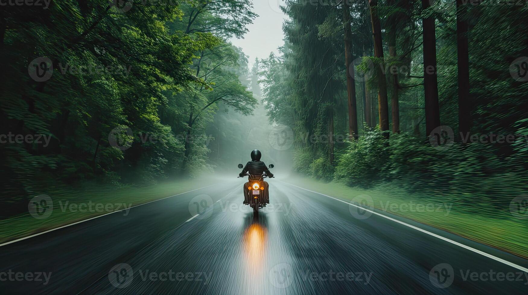 AI generated a motorbike driver navigating through the rain on a densely tree-lined road, the shimmering raindrops and lush foliage creating a captivating ambiance of nature's embrace photo