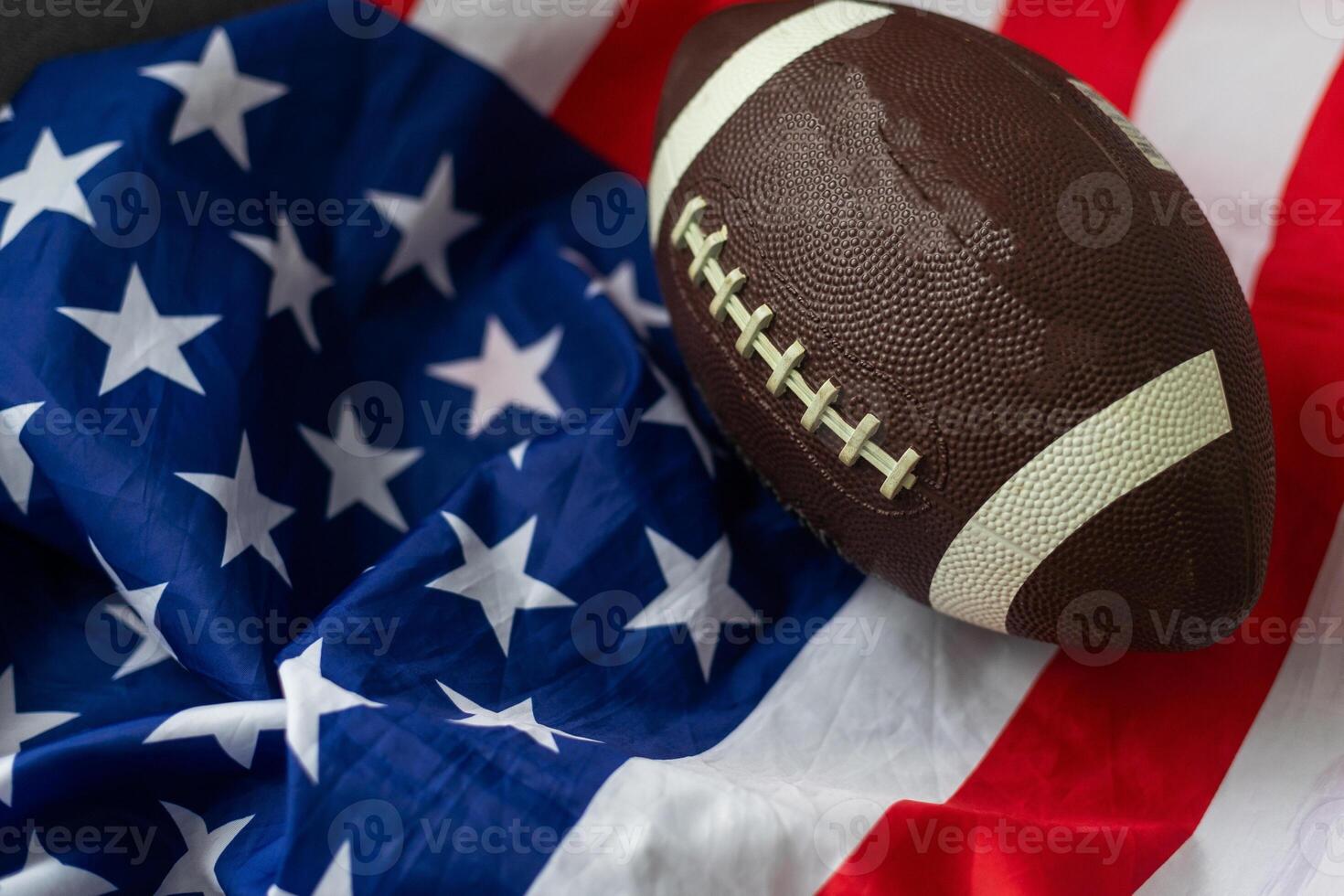 American football on American old glory flag. photo
