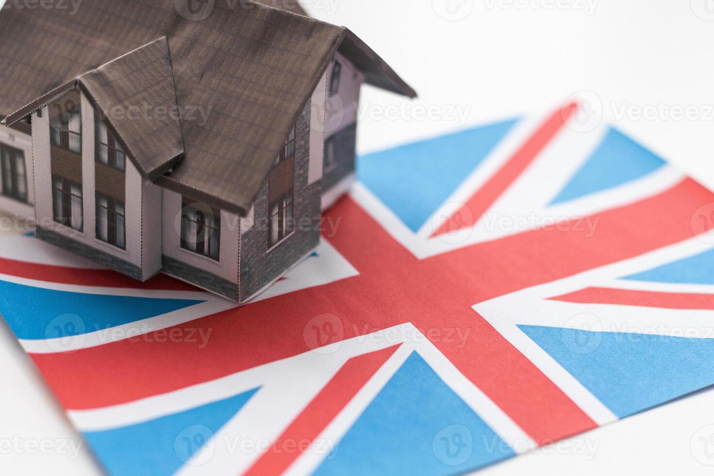 Small house on a flag - Living or migrating to United Kingdom photo