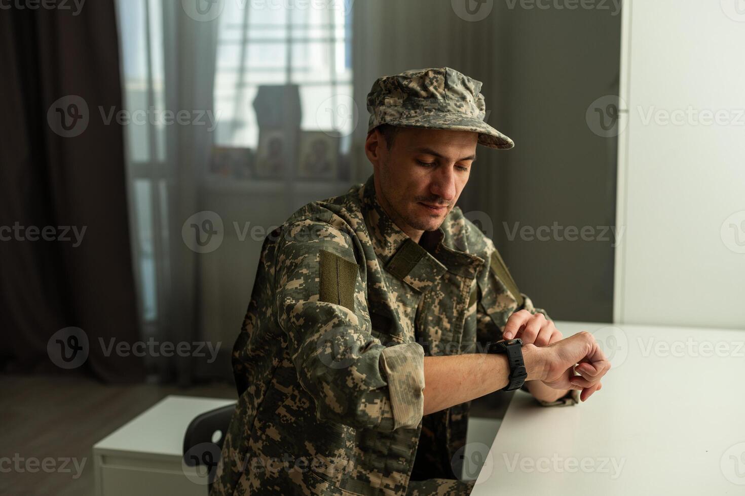 The soldiers - our pride. Special forces soldier with rifle on dark background. Modern soldier with rifle photo