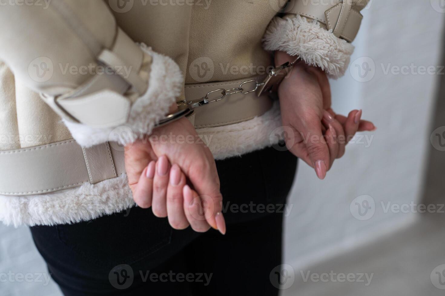 Teenager wearing handcuffs and is caught by the police photo