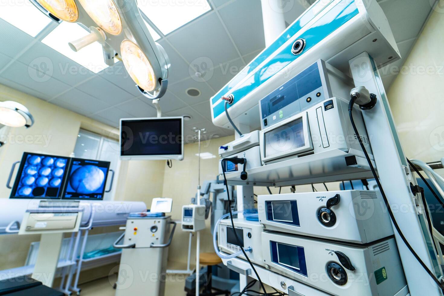 Medical devices and industrial lamps in surgery room of modern hospital. Interior hospital design concept photo