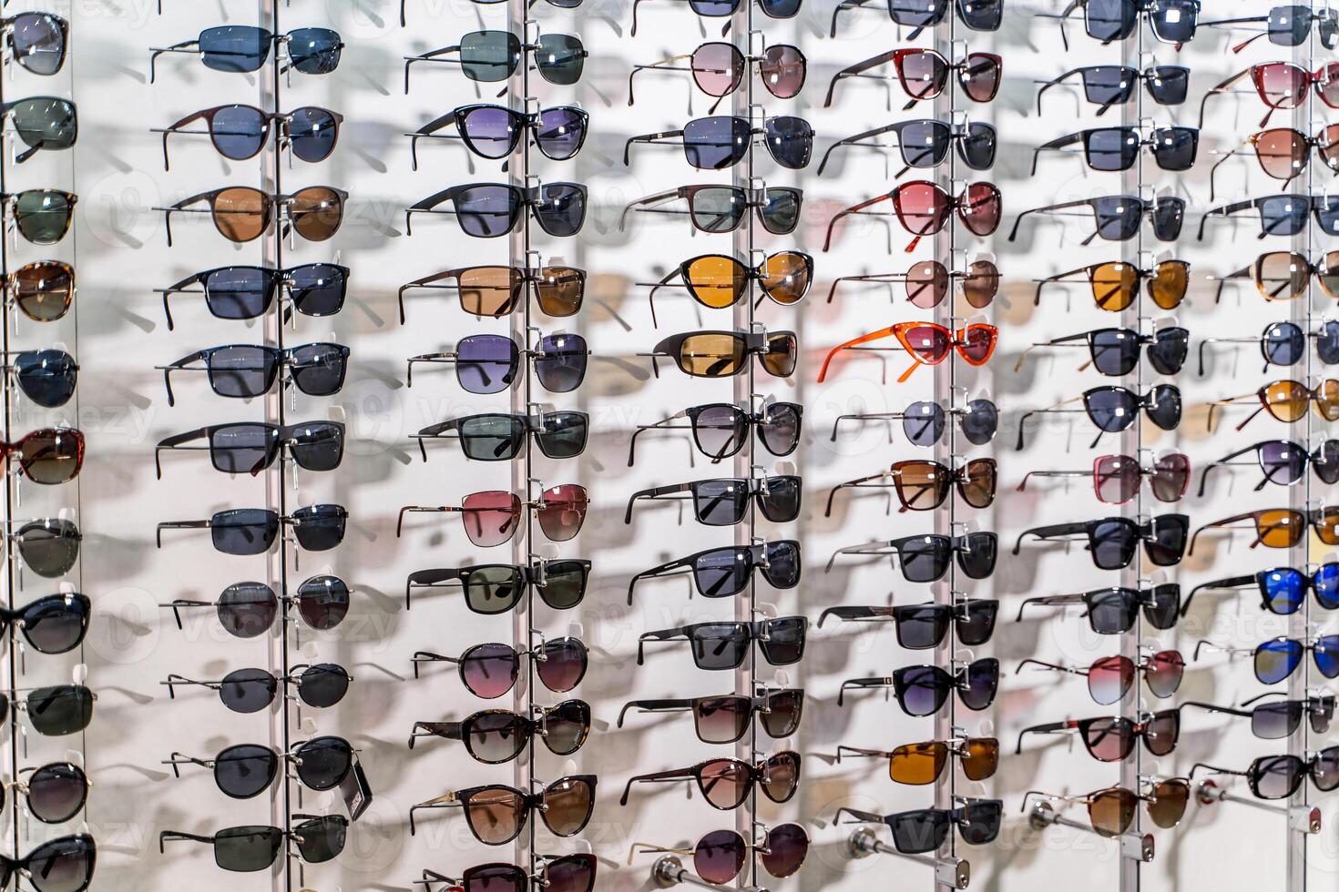 Sales rack of sunglasses. A colorful display of sunglasses for sale photo