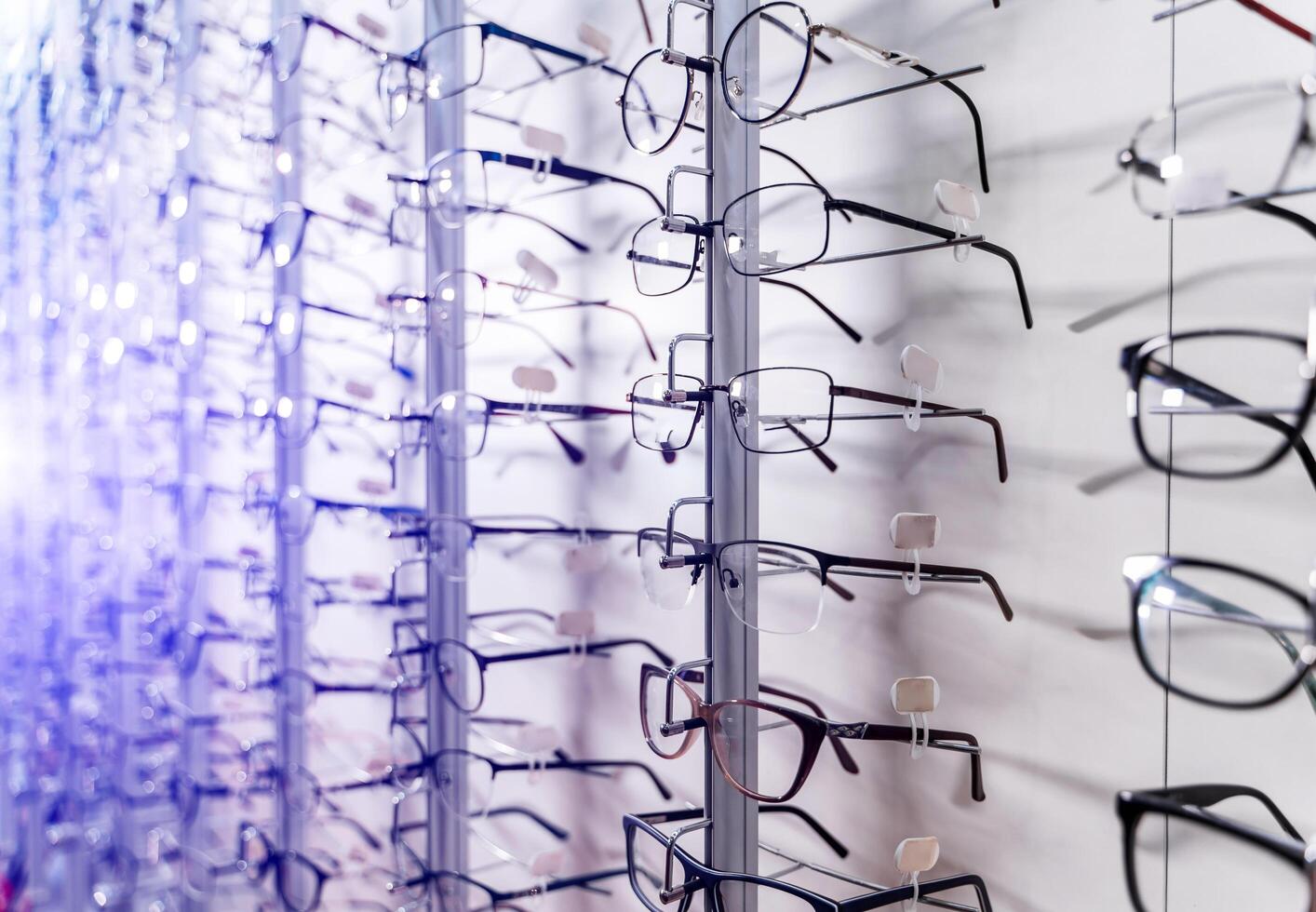 Row of luxury eyeglass at an opticians store. photo