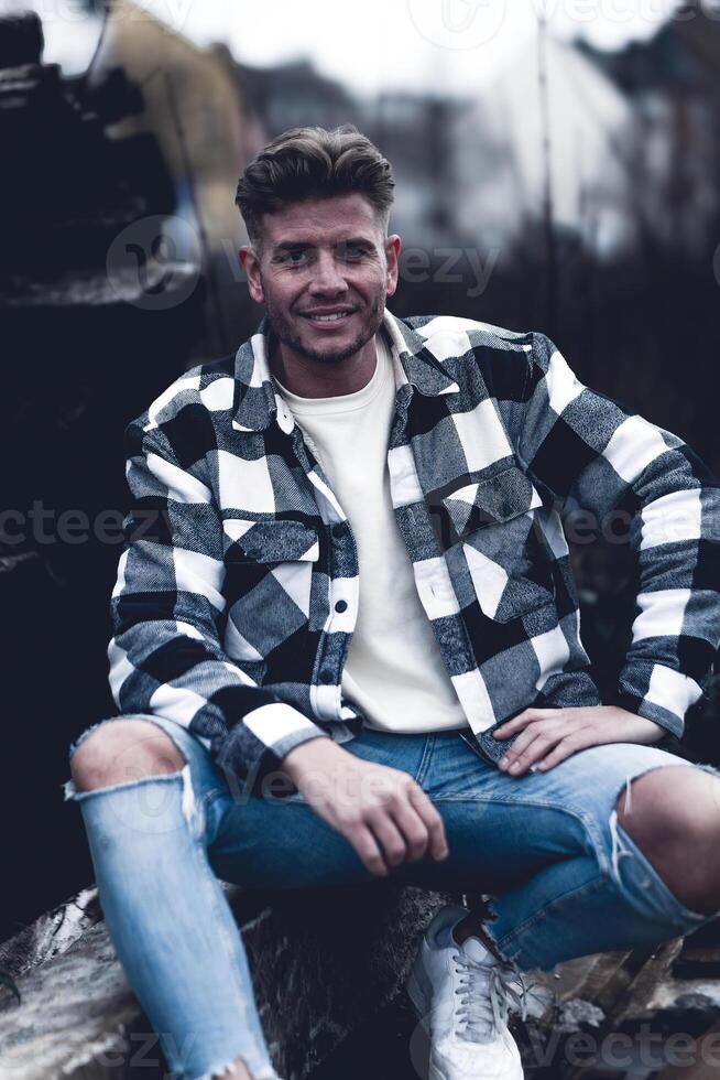 attractive young man in a denim shirt photo