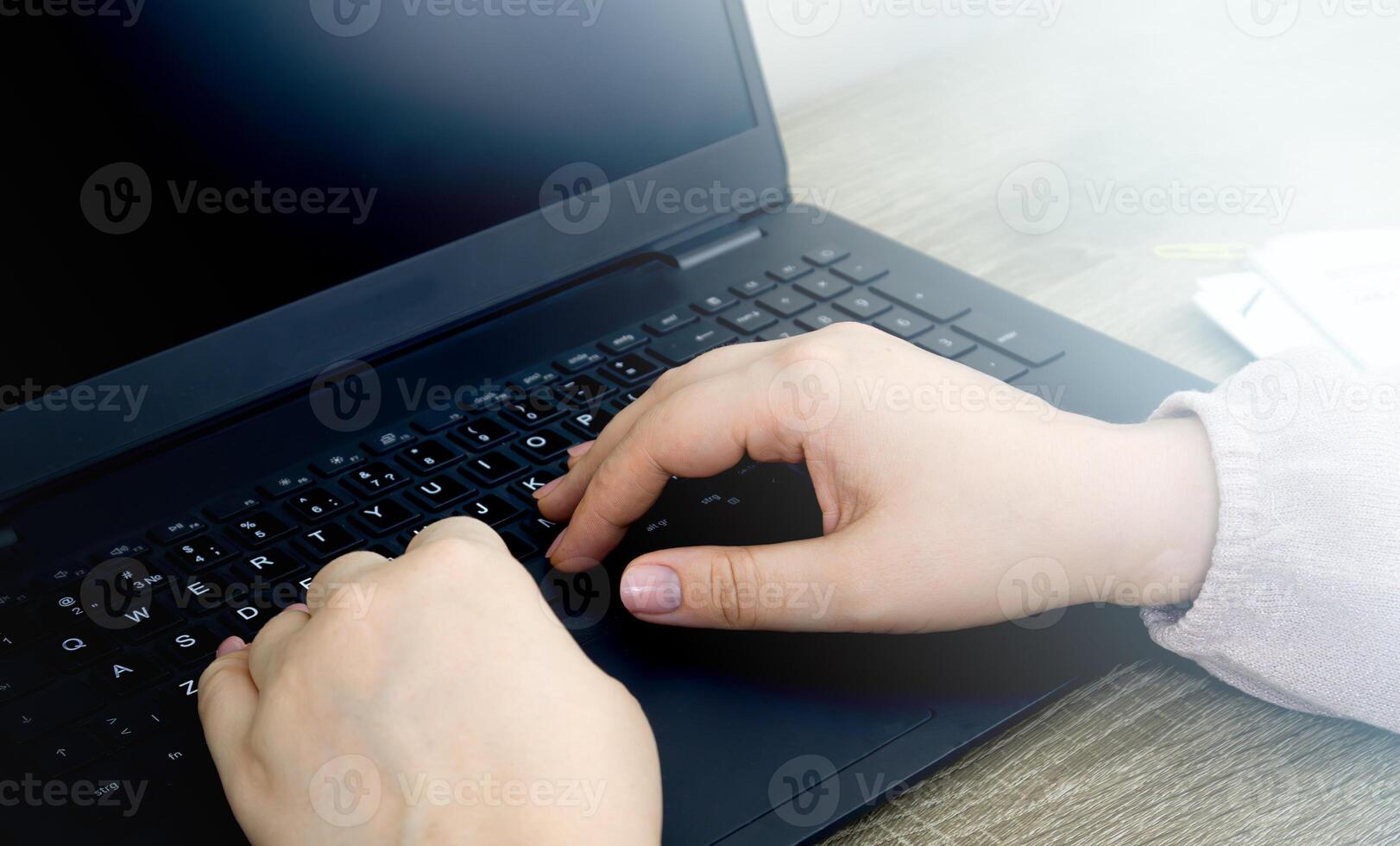 Person Typing on a Laptop Computer photo