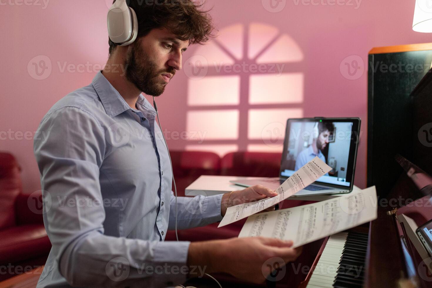 Man Teaching Piano Music Lesson With Remote Connection photo
