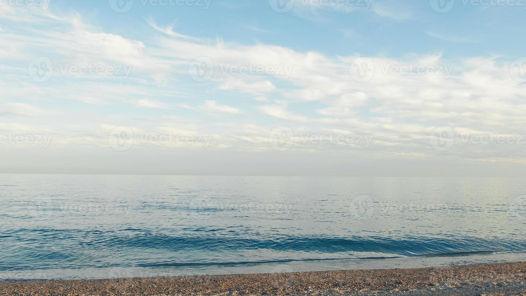 Sicilian coastline With Slow Waves Of Sea crashing On The Shore photo