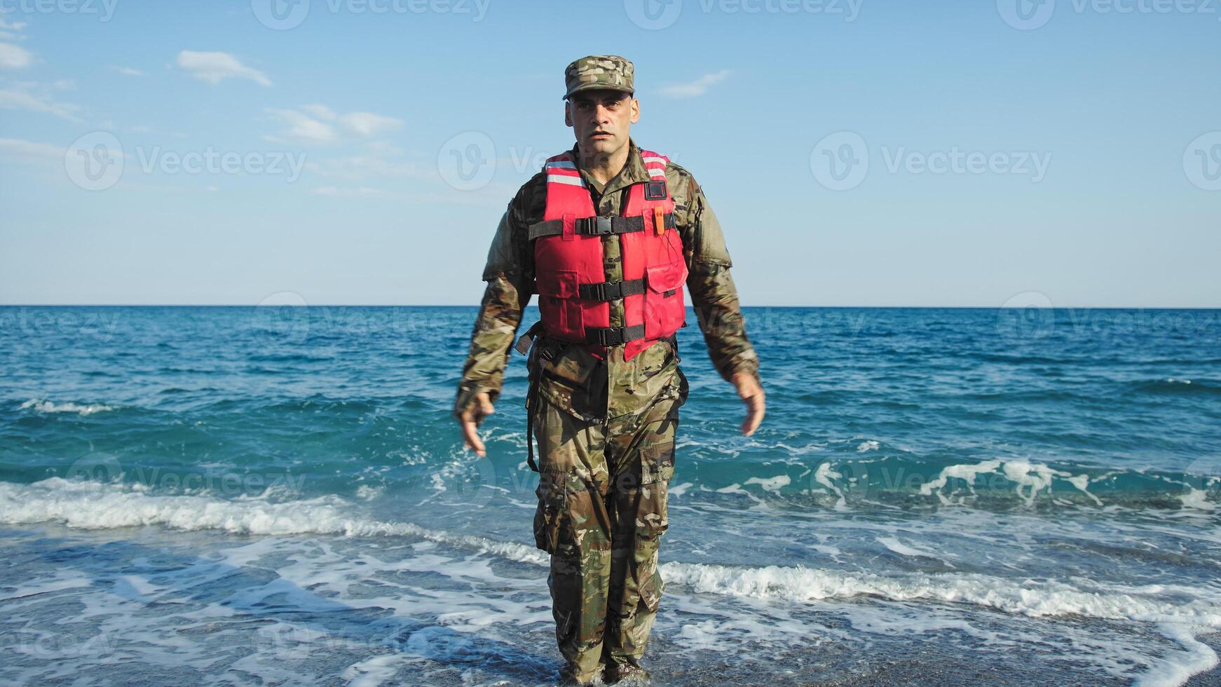 Military usa man training jumping jack in the shore near the ocean photo