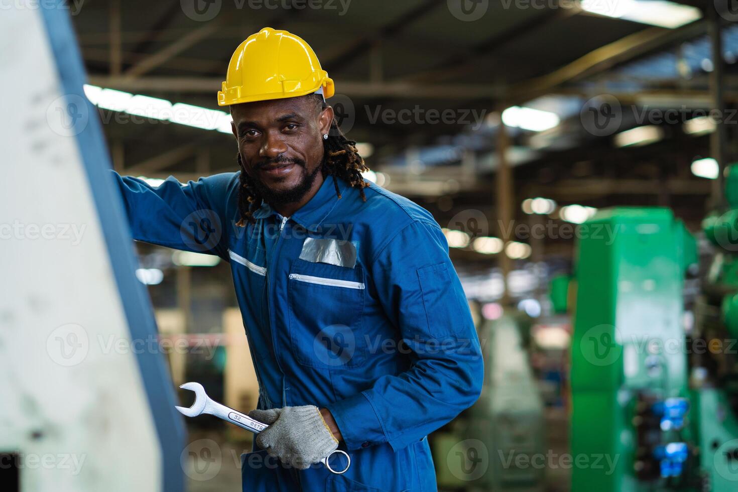 Black male mechanical engineer working at metal lathe factory Machine lathe operating engineer African American people. photo