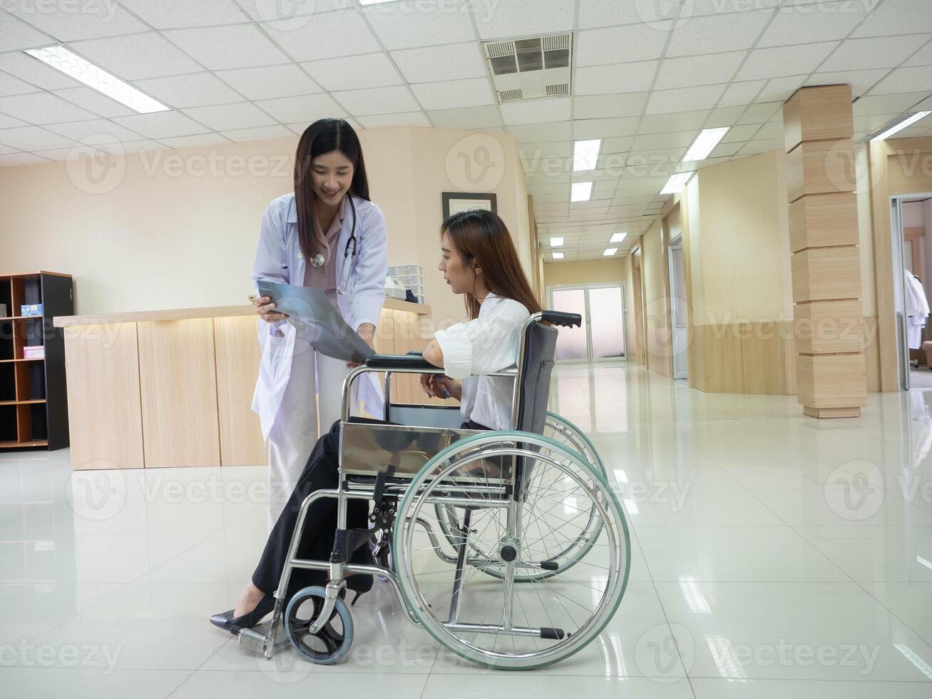 Doctor nurse staff assistance staff female woman lady person people human wheelchair patient look visit report hospital clinic senior recovery retirement disease senior disability illness nursing home photo