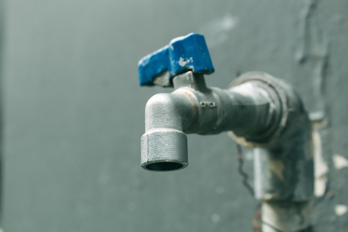 the old water tap is blue photo