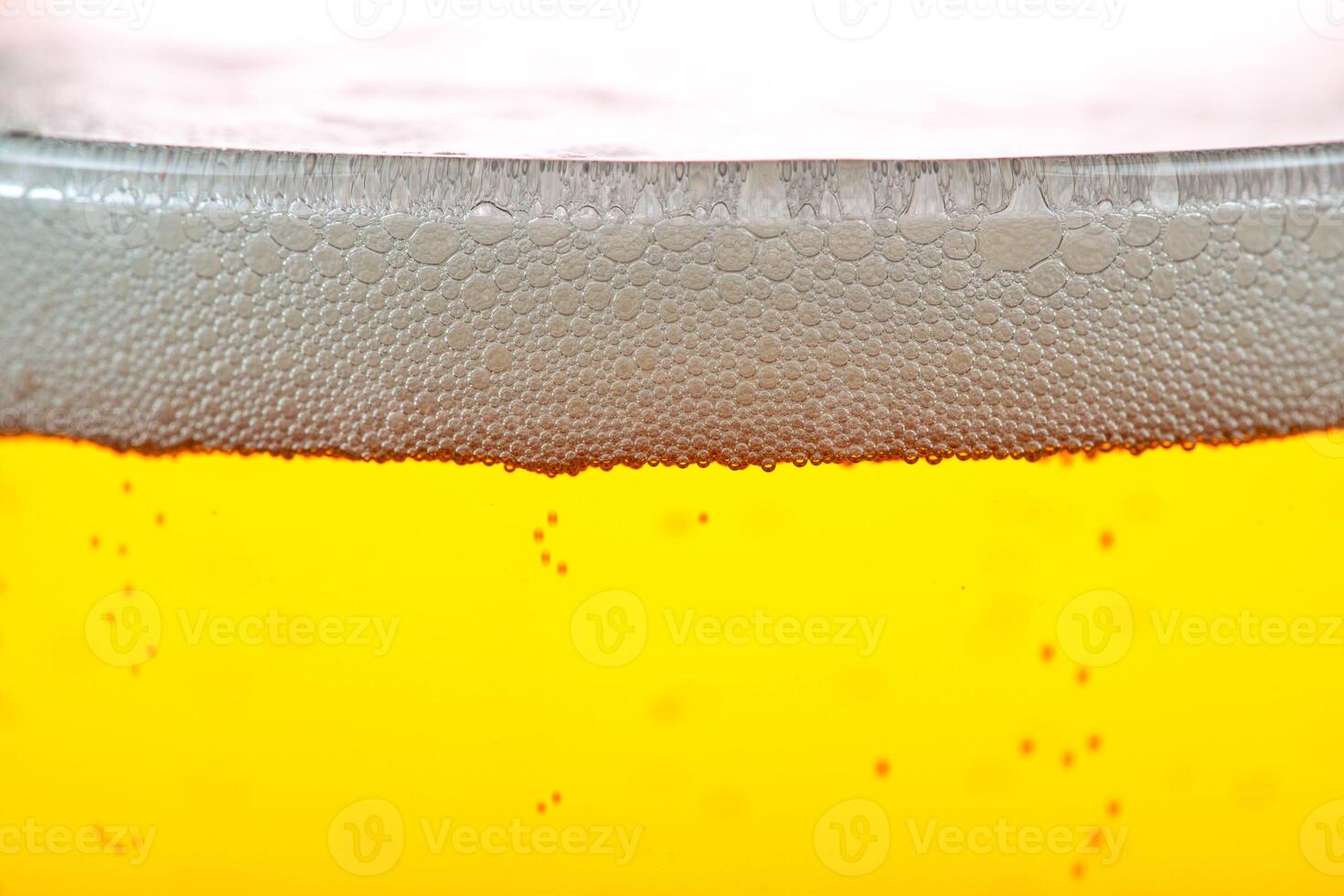 Beer bubbles and foam close up photo