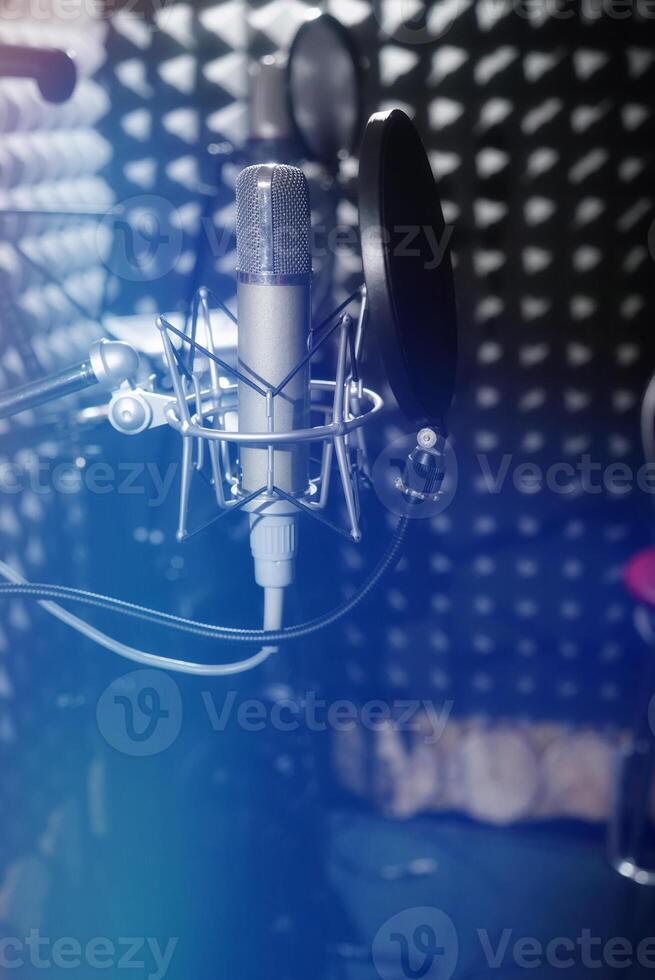 Professional microphone in the recording studio. Musical Concept. Microphone on stage. photo