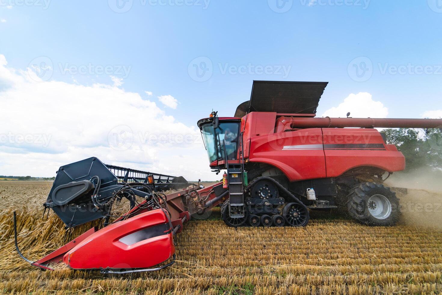 Combine harvester in action on the field. Combine harvester. Harvesting machine for harvesting a wheat field. photo