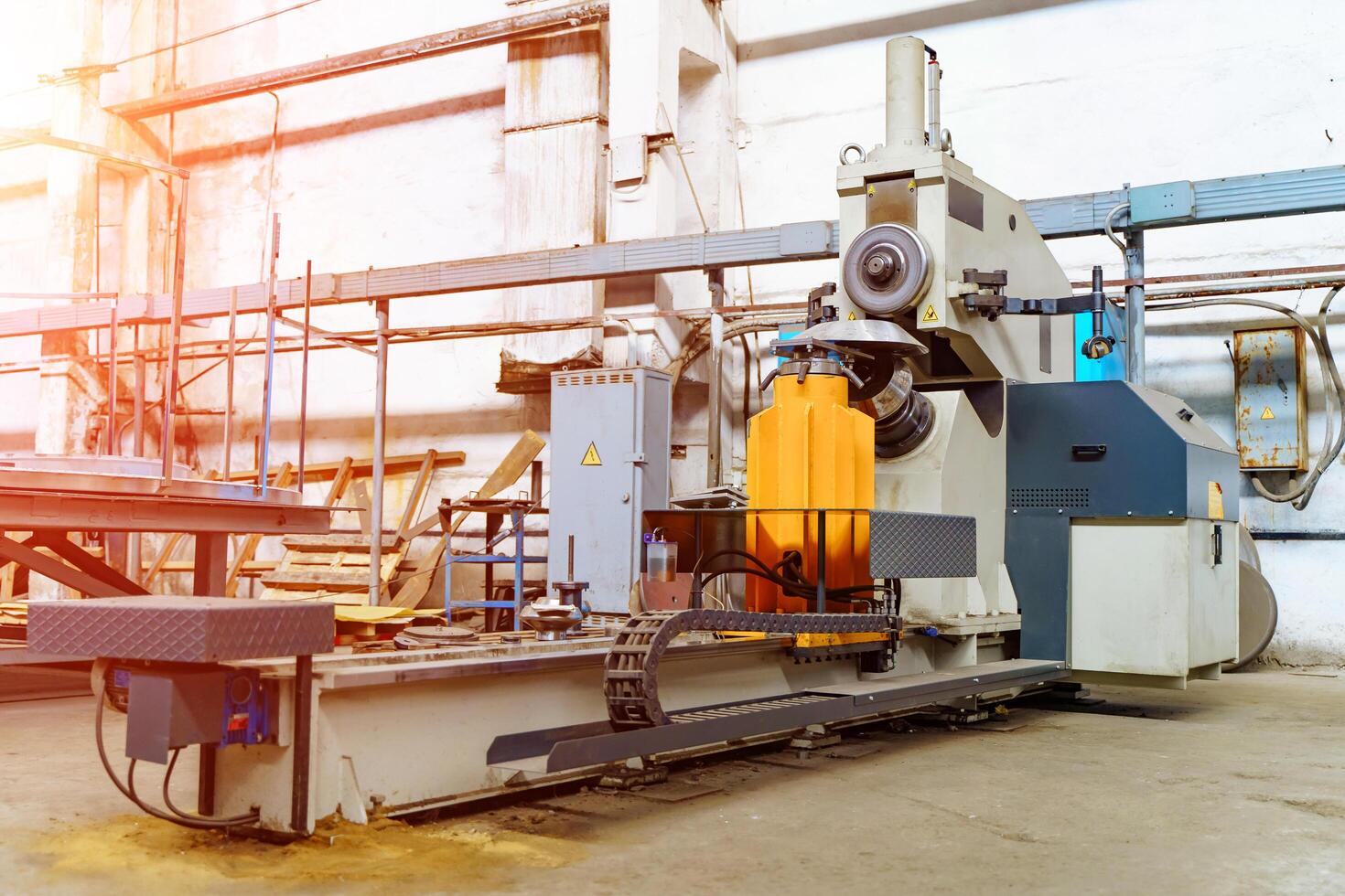 Industrial machine in the factory at metalworks. Warehouse,industrial interior, production zone. Closeup photo