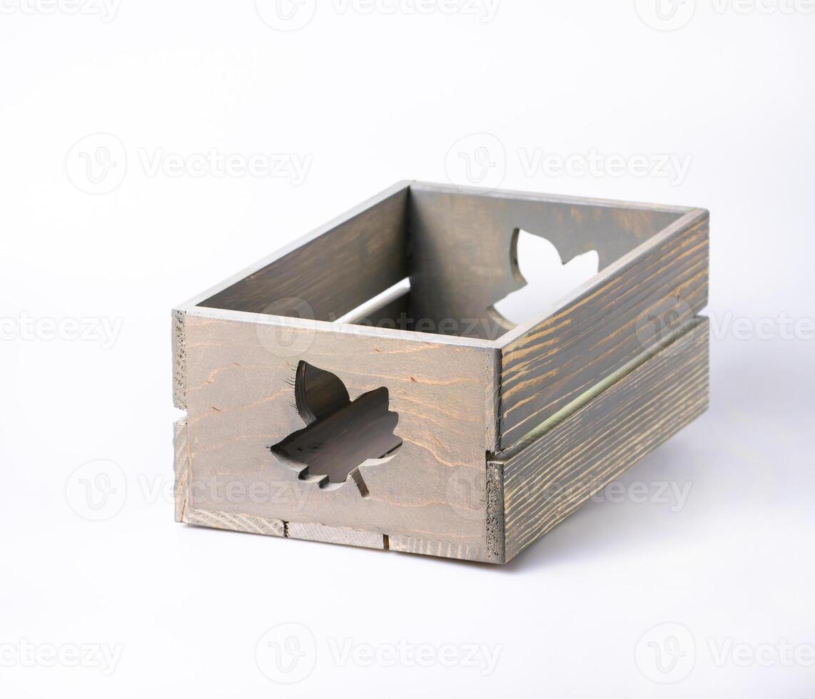 Empty decorative wooden crate isolated on white photo