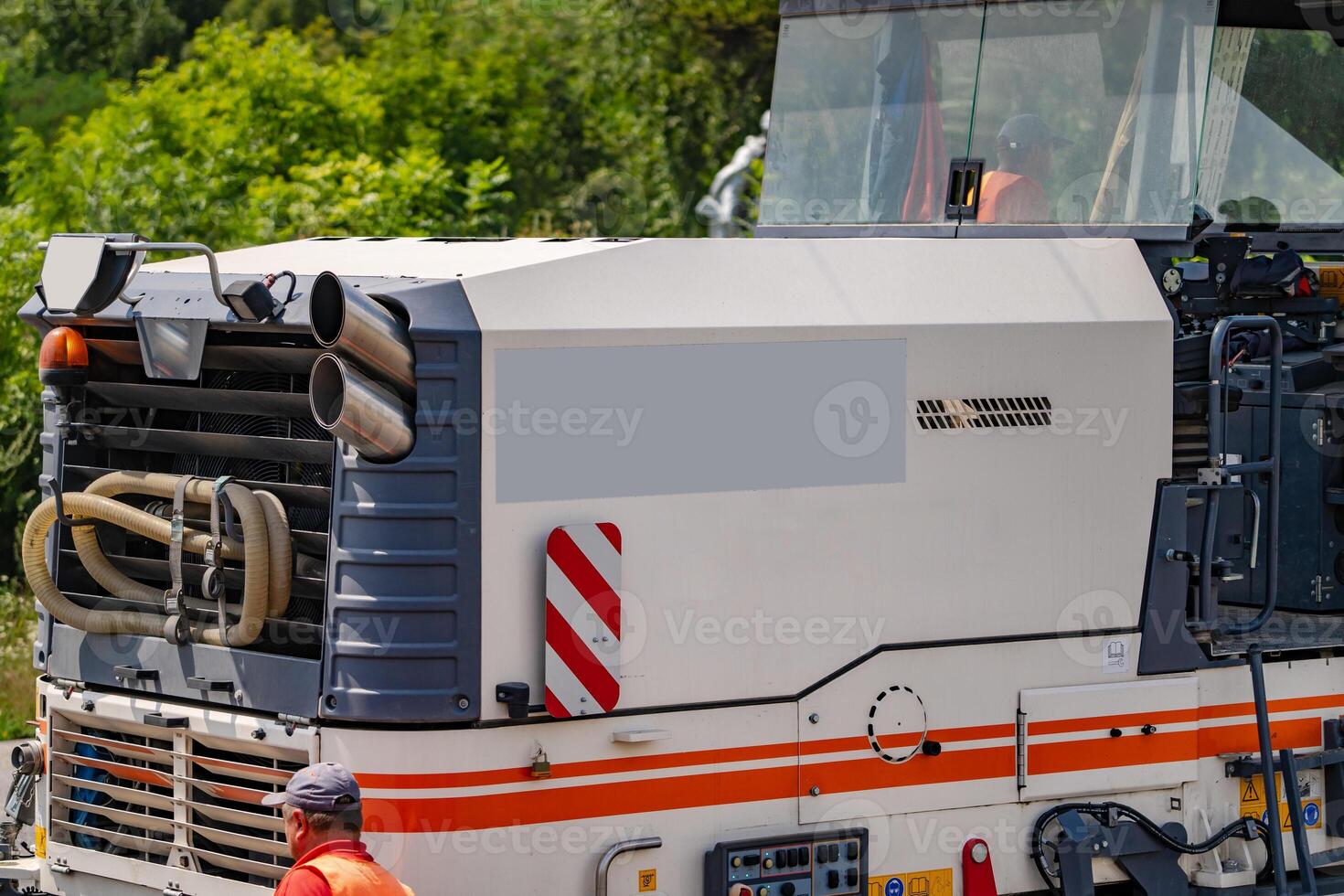 Asphalt skating rink. Road equipment for asphalt work. Pavement repair work. Cropped photo, closeup photo