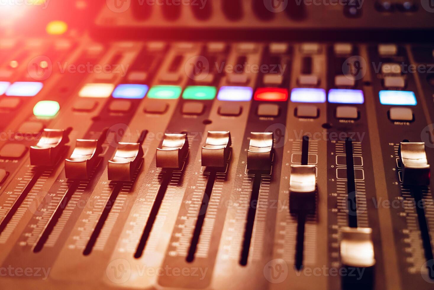 professional concert mixing console is equipped with high-precision and long-stroke faders. Close-up photo