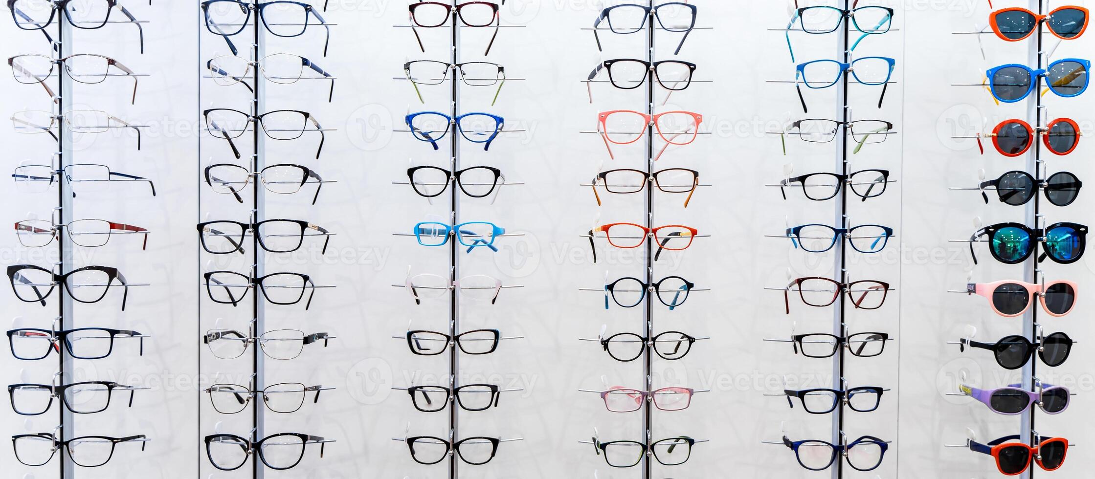 Showcase with spectacles in modern ophthalmic store. Eyeglasses shop. Eyesight correction. photo