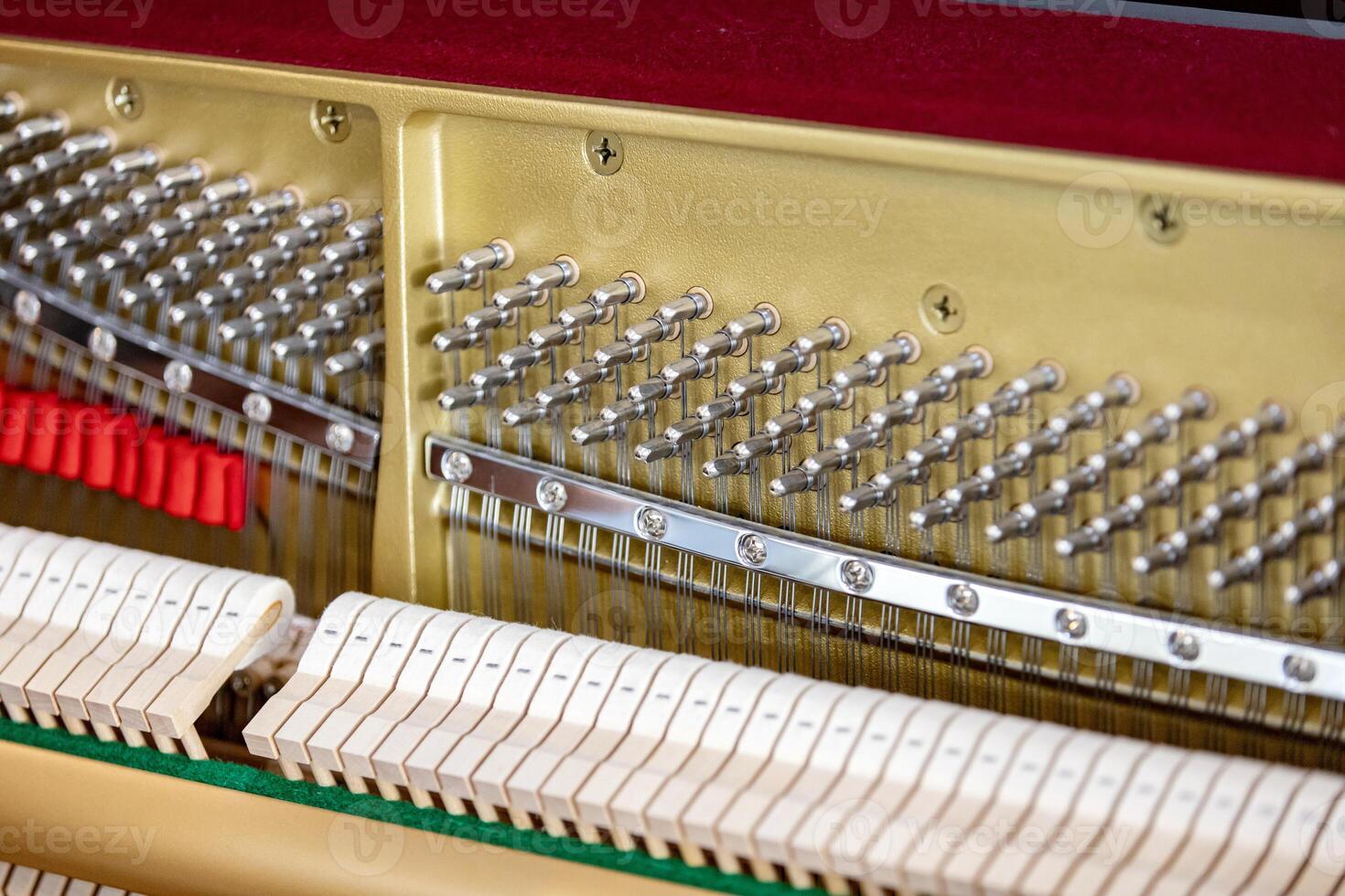 Shallow focus close-up of tools for tuning the internal mechanisms of an upright piano. Gives a feeling of luxury, classic, luxury, grandeur. Pictures can be used on various topics related to music. photo