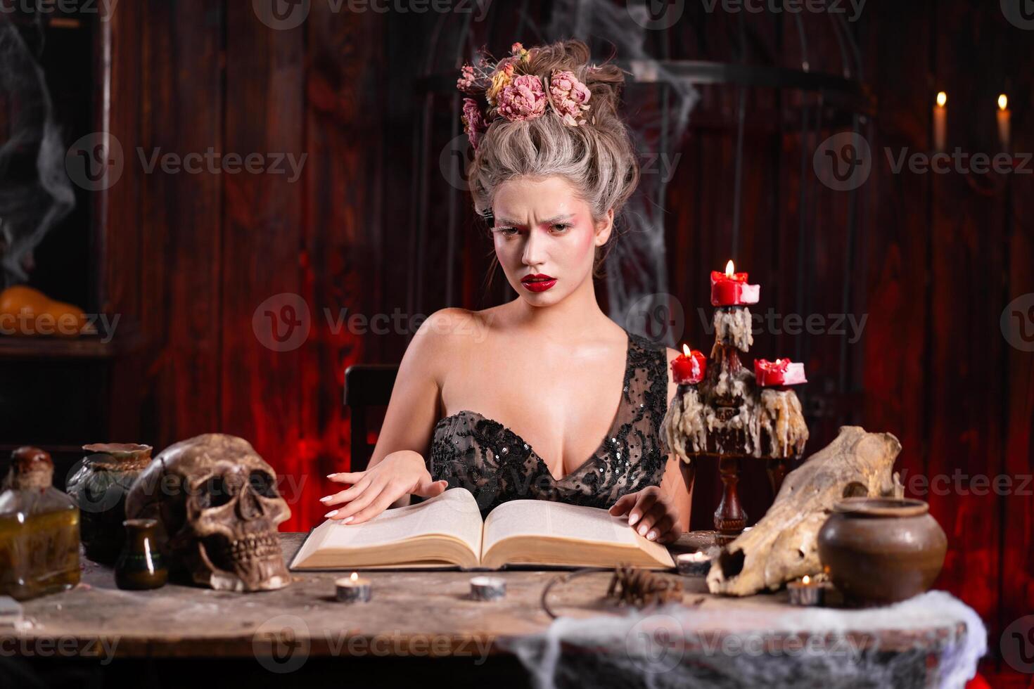 Portrait fortune teller woman reading future on magical spell books. Magic and divination. photo