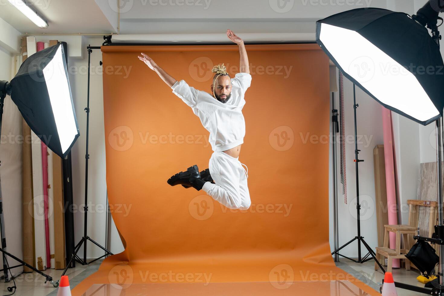 Gay man dancing in photo studio