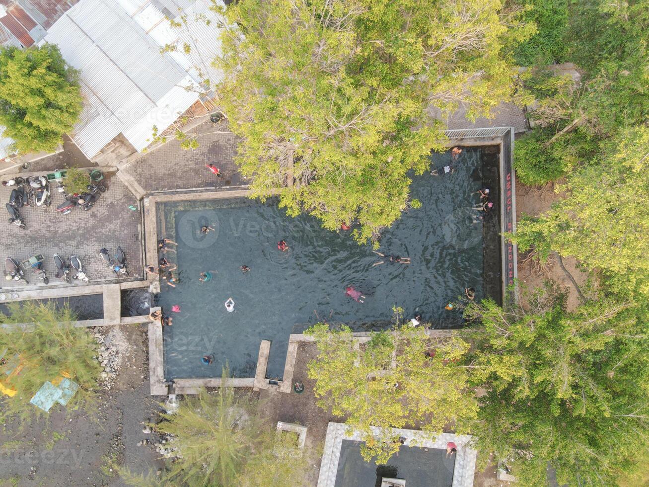 Aerial view of a pond of natural water springs in Klaten, Central Java, Indonesia photo