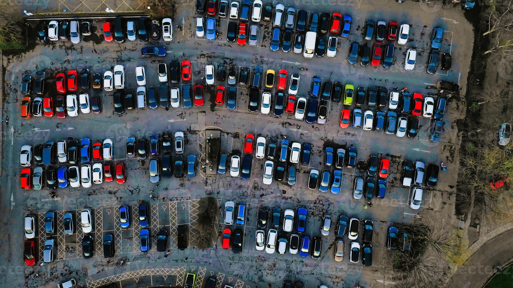 Aerial view of a crowded parking lot with various cars neatly parked in rows, showcasing urban transportation and infrastructure in York, North Yorkshire photo