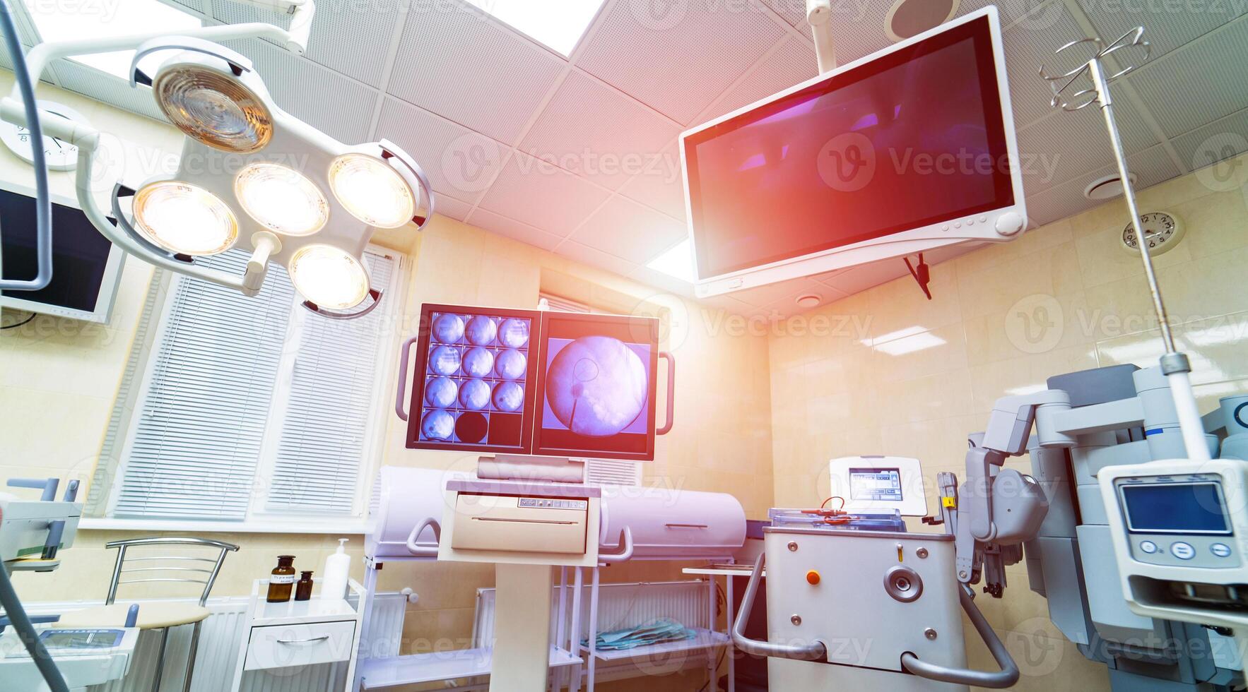 Medical devices and industrial lamps in surgery room of modern hospital. Interior hospital design concept photo