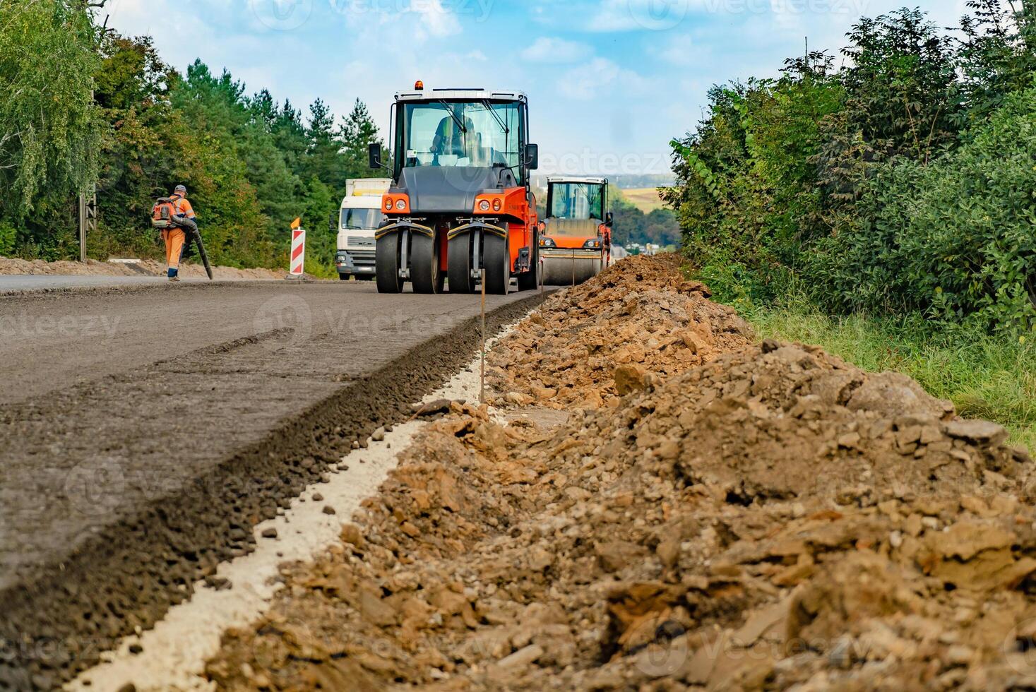 carrying out repair work with the help of special equipment for road works photo