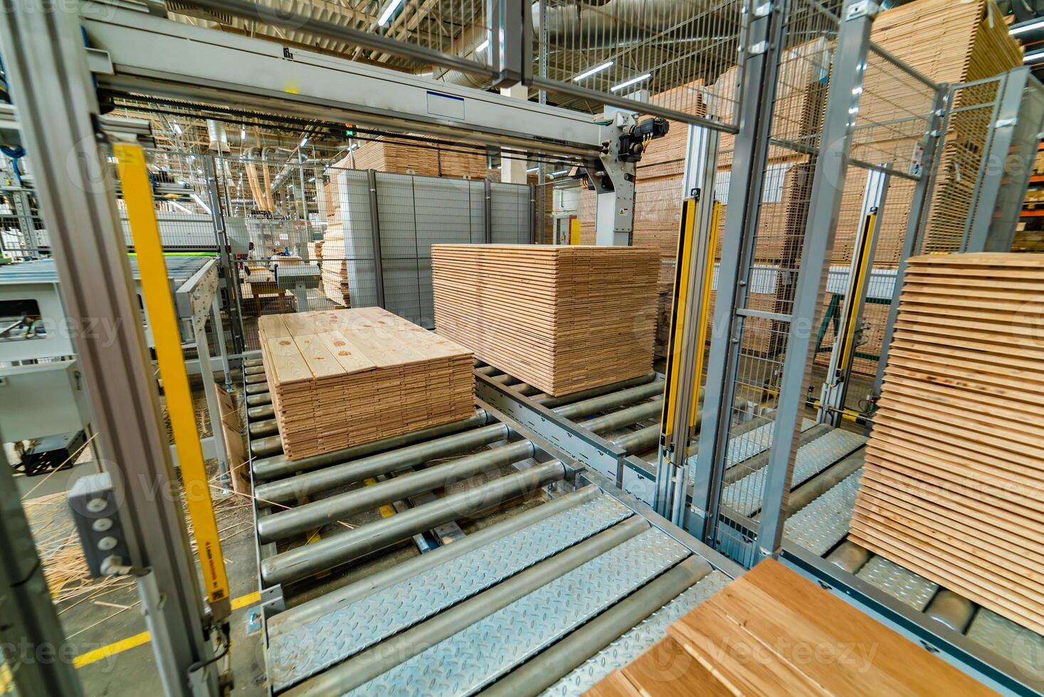 modern automatic line for processing floorboard in the production. photo