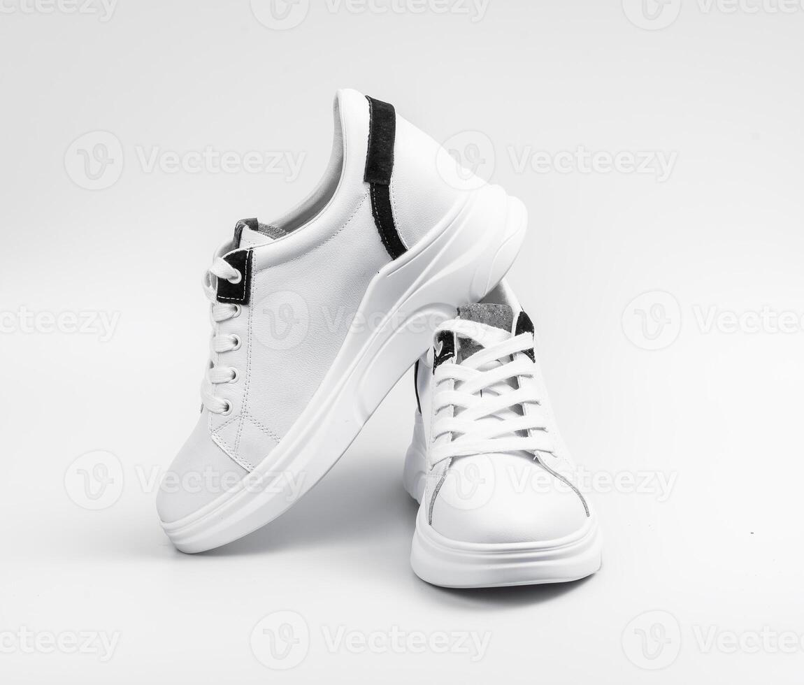 New unbranded running shoe, sneaker or trainer isolated on white background photo