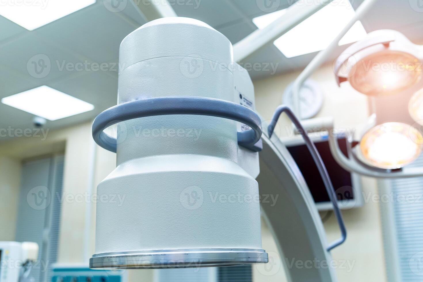 Lamp in operating room in hospital. Equipment and medical devices in modern operating room. Operating theatre. Selective focus. photo