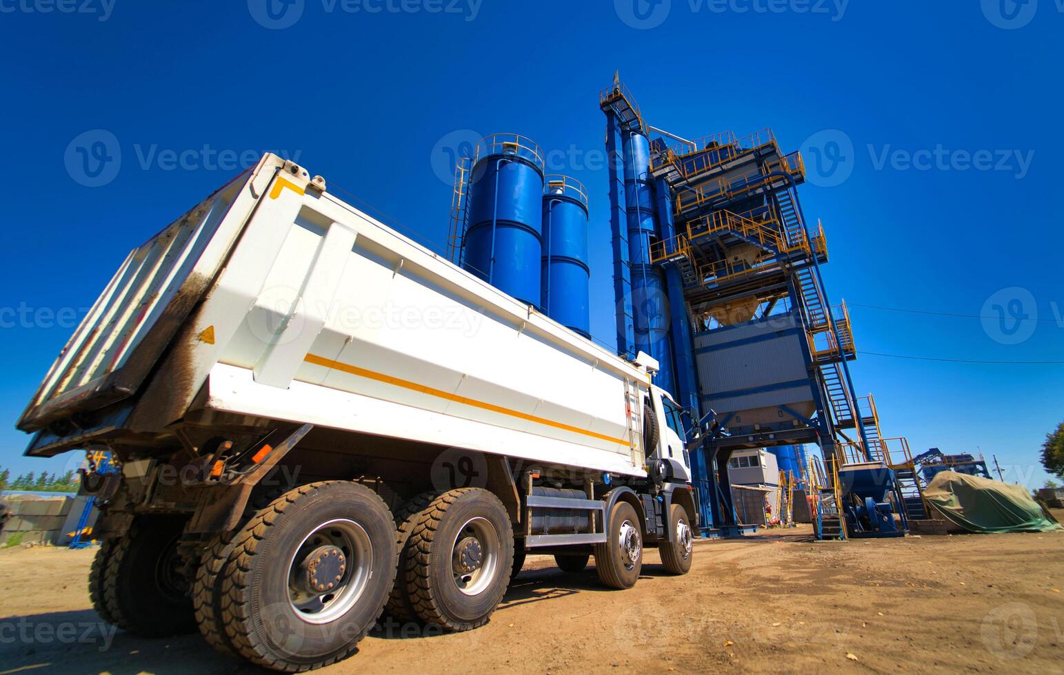 The truck is ready to load gravel or sand in concrete station. Asphalt production, Road construction. photo