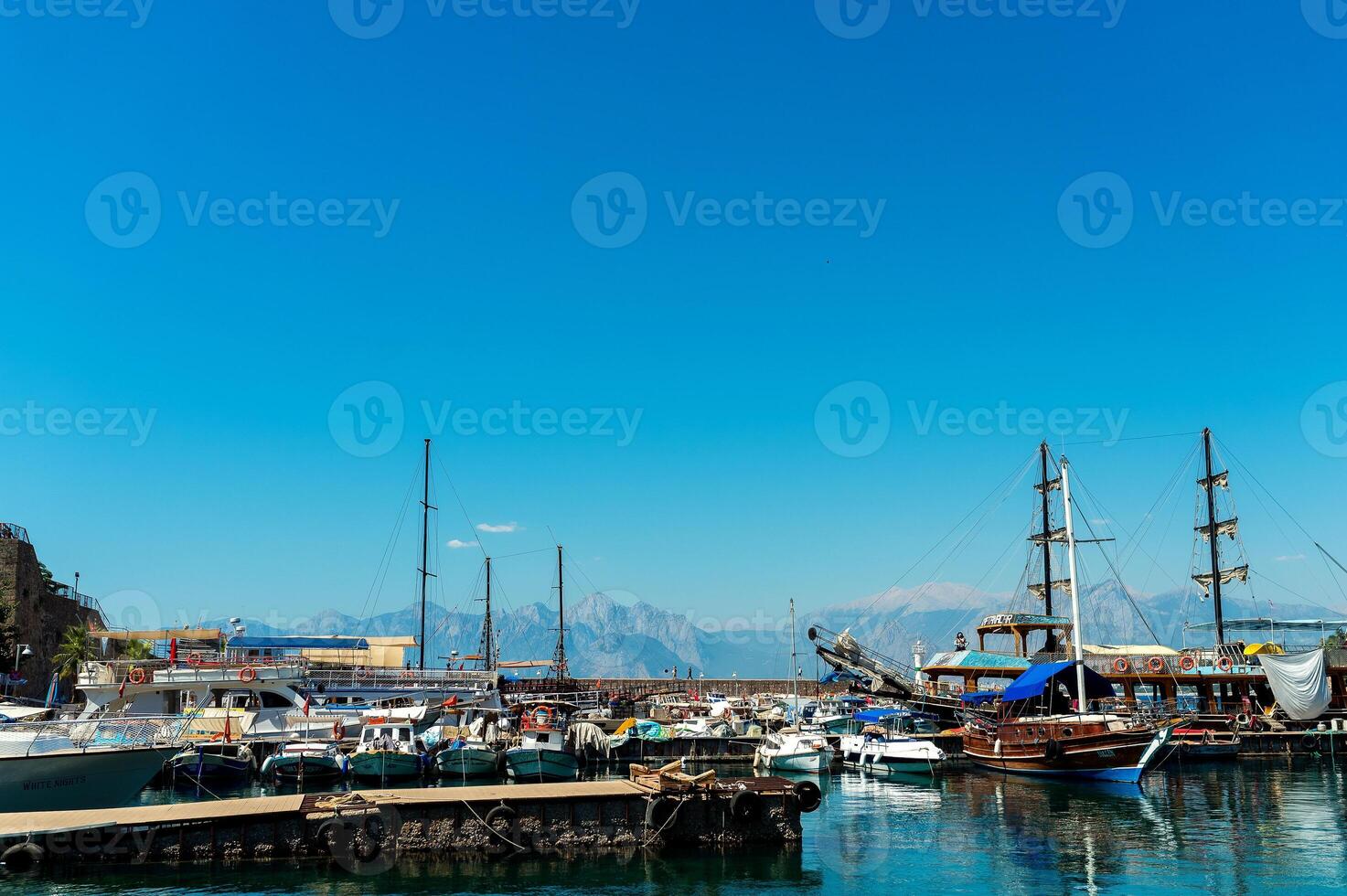 Yacht and boats docking at the marina in the evening. Vocation concept. photo